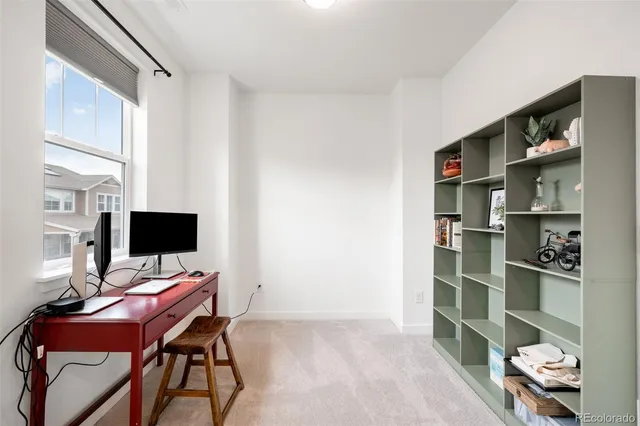 a view of a workspace with furniture