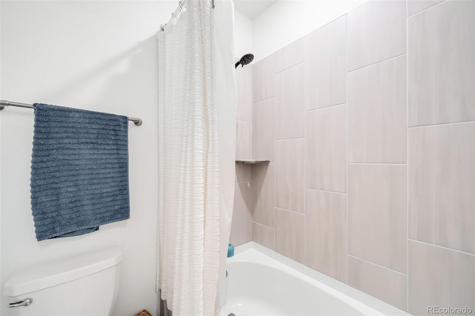 1928 Marlowe Circle West Erie, CO 80516 - Photo 22 of 47 a bathroom with a bathtub and shower