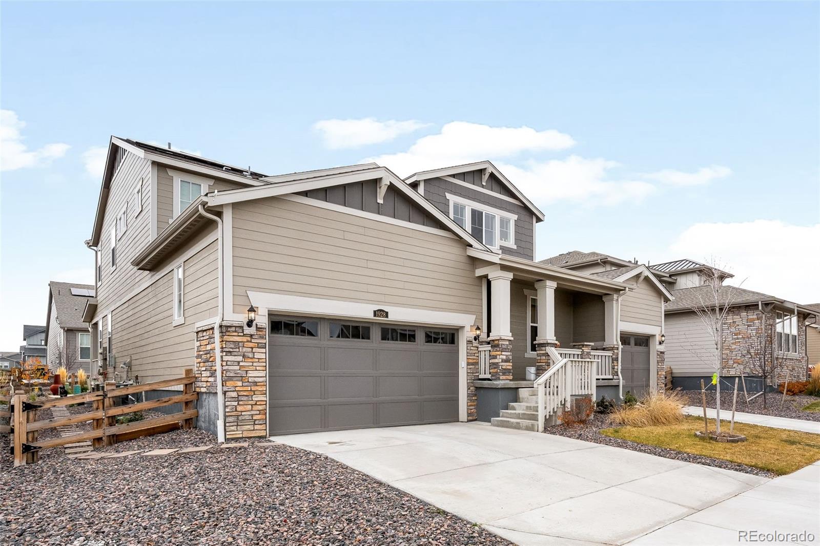 1928 Marlowe Circle West Erie, CO 80516 - Photo 3 of 47 a view of a white house with a small yard and potted plants