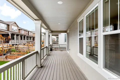 a view of a balcony with wooden floor