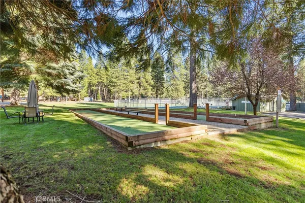 a view of a swimming pool with a patio and yard