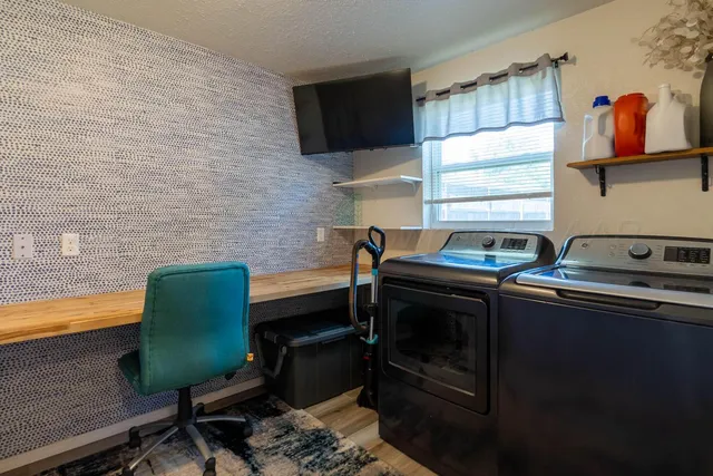 a kitchen that has a sink and a stove top oven