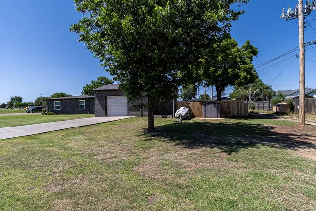 a backyard of a house with lots of green space