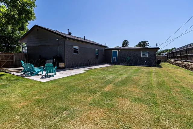 a view of a couches in backyard of house