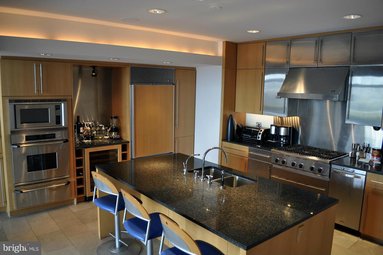 3618 Prospect Street Northwest Washington, DC 20007 - Photo 14 of 30 a kitchen with kitchen island a stove and a sink