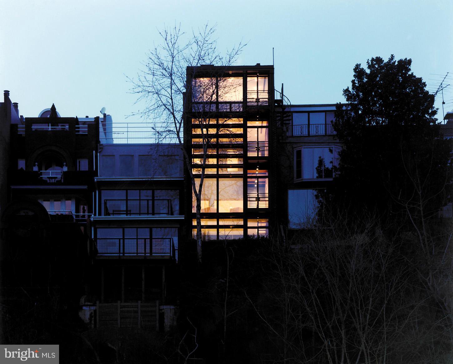 3618 Prospect Street Northwest Washington, DC 20007 - Photo 3 of 30 a backyard of a house with table and chairs