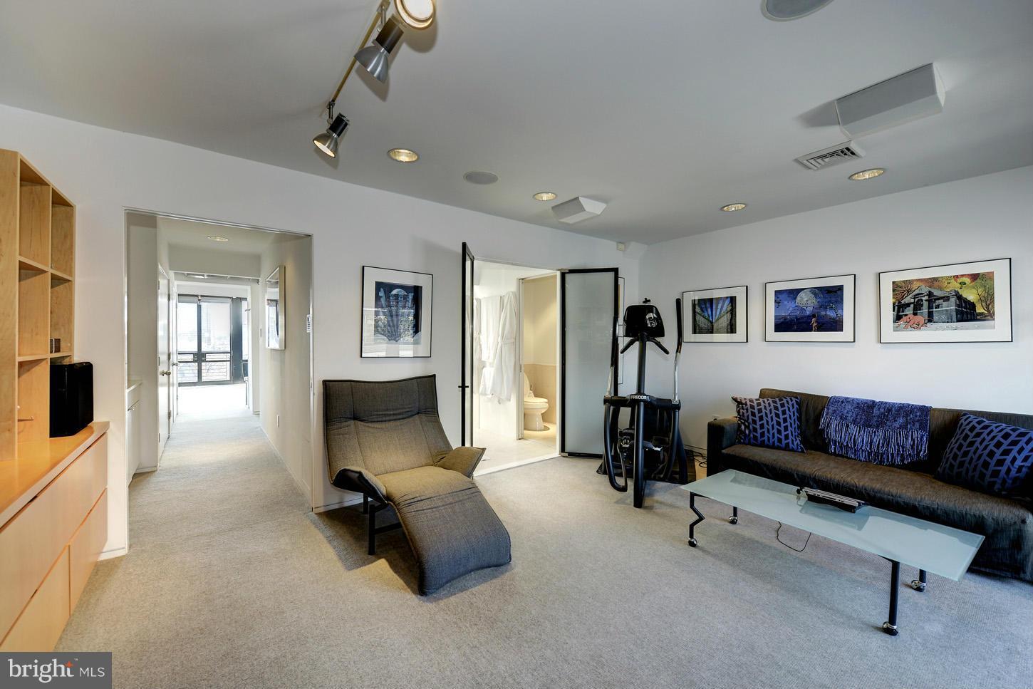 3618 Prospect Street Northwest Washington, DC 20007 - Photo 22 of 30 a living room with furniture and a flat screen tv