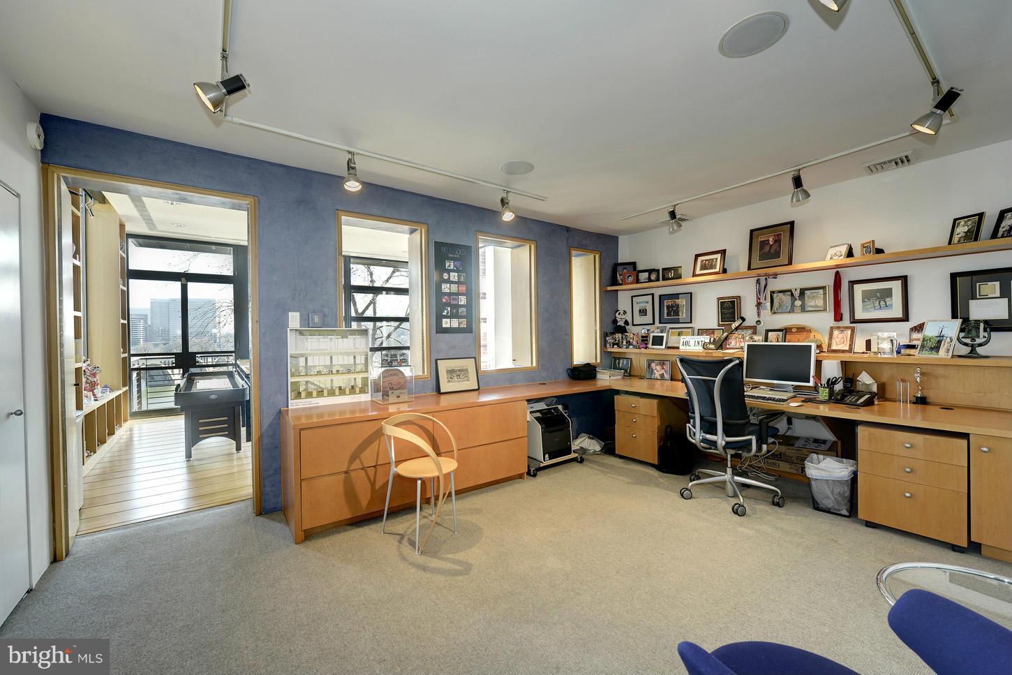 3618 Prospect Street Northwest Washington, DC 20007 - Photo 27 of 30 a bed room with furniture and a chandelier