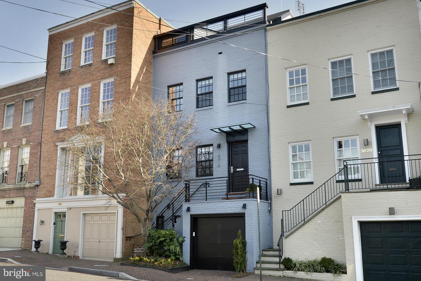 3618 Prospect Street Northwest Washington, DC 20007 - Photo 29 of 30 a front view of a house with a tree