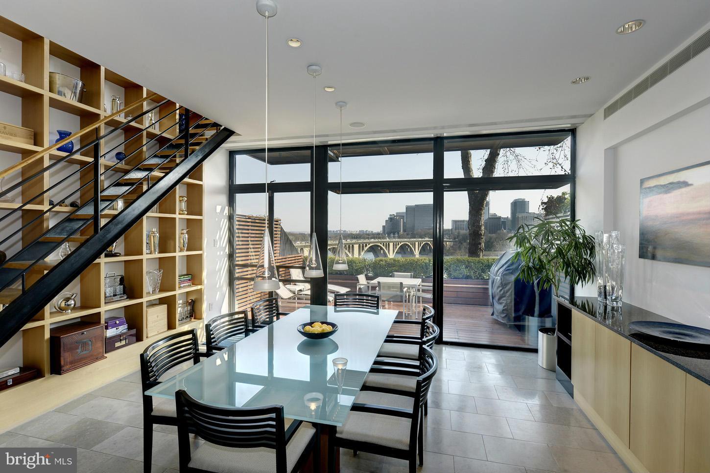 3618 Prospect Street Northwest Washington, DC 20007 - Photo 9 of 30 a view of dining room and livingroom with furniture wooden floor and a rug