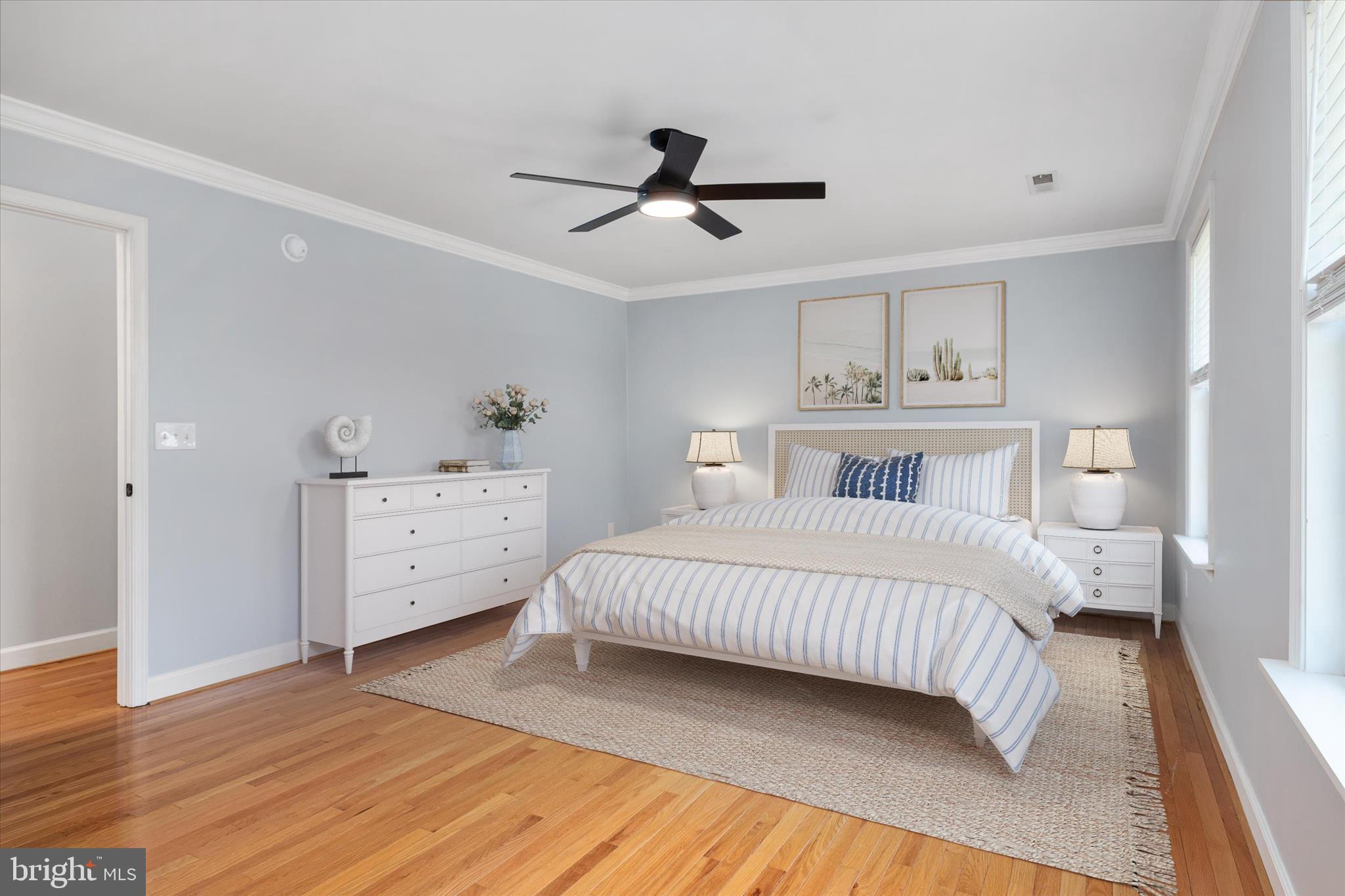 913 Clark Corner Road Centreville, MD 21617 - Photo 26 of 66 a bedroom with a bed and wooden floor