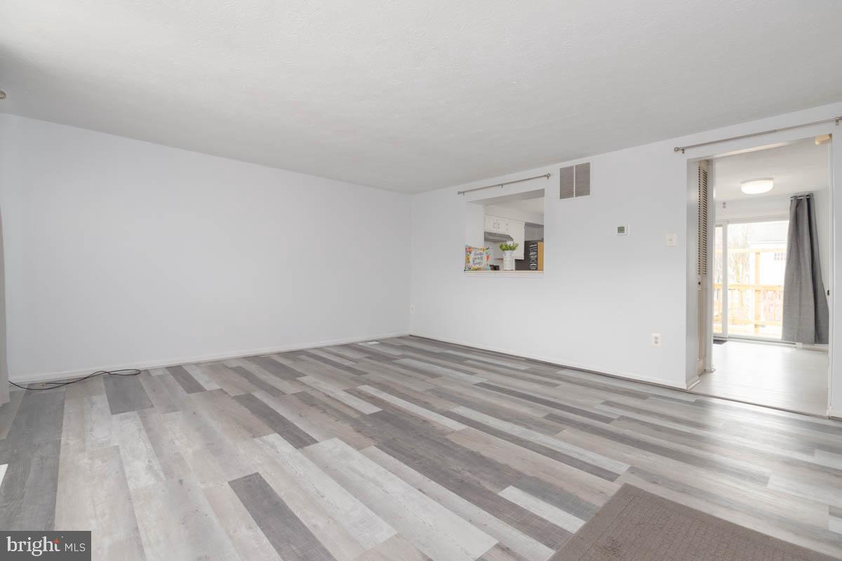 1312 Acorn Ridge Court Edgewood, MD 21040 - Photo 8 of 39 a view of empty room with wooden floor and fan