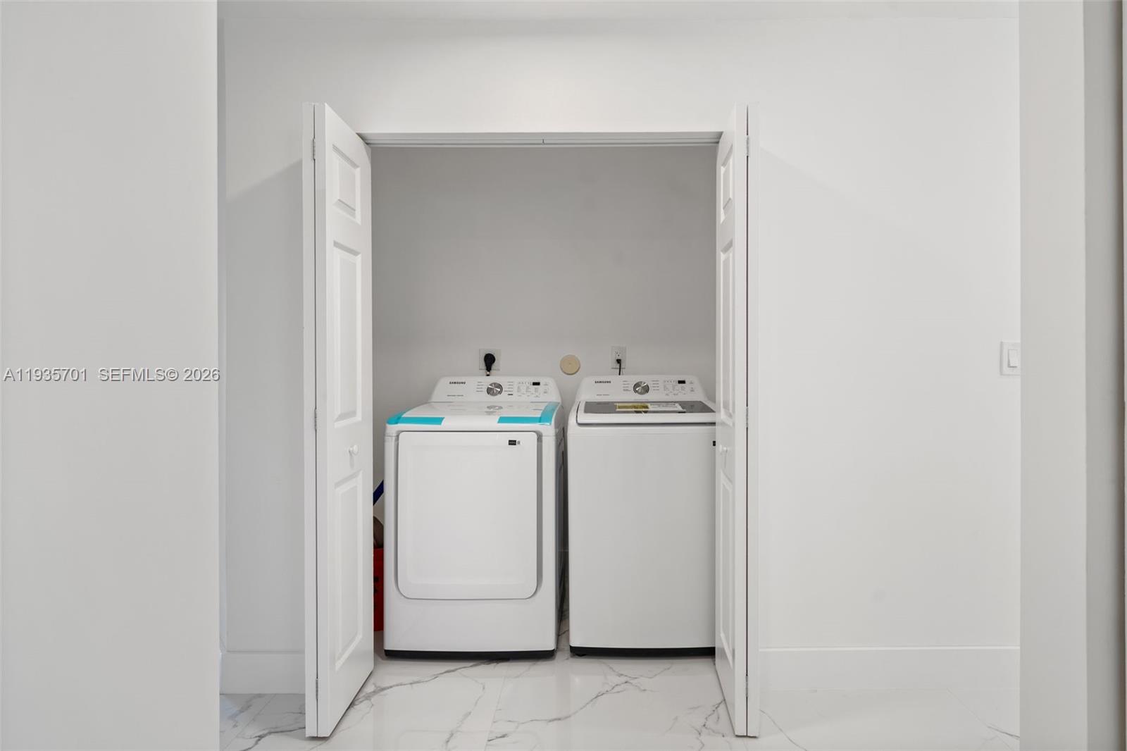 253 Southwest 4th Street Dania Beach, FL 33004 - Photo 18 of 27 a utility room with dryer and washer