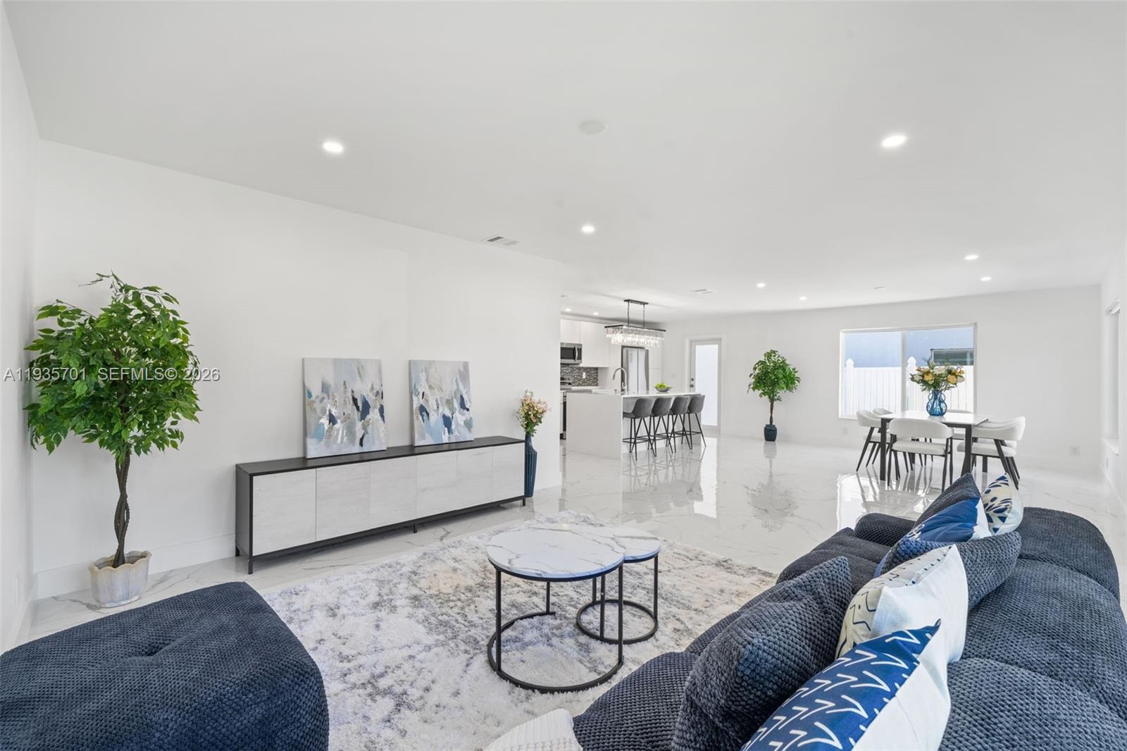 253 Southwest 4th Street Dania Beach, FL 33004 - Photo 3 of 27 a living room with furniture and wooden floor