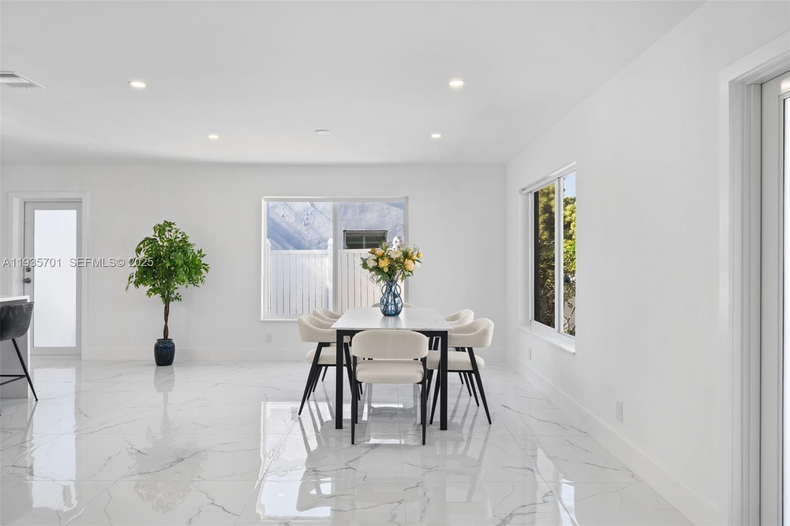 253 Southwest 4th Street Dania Beach, FL 33004 - Photo 3 of 27 a dining room with furniture and potted plants