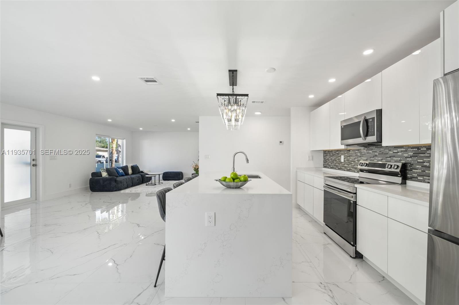 253 Southwest 4th Street Dania Beach, FL 33004 - Photo 4 of 27 a kitchen with a sink stainless steel appliances and lots of counter top space