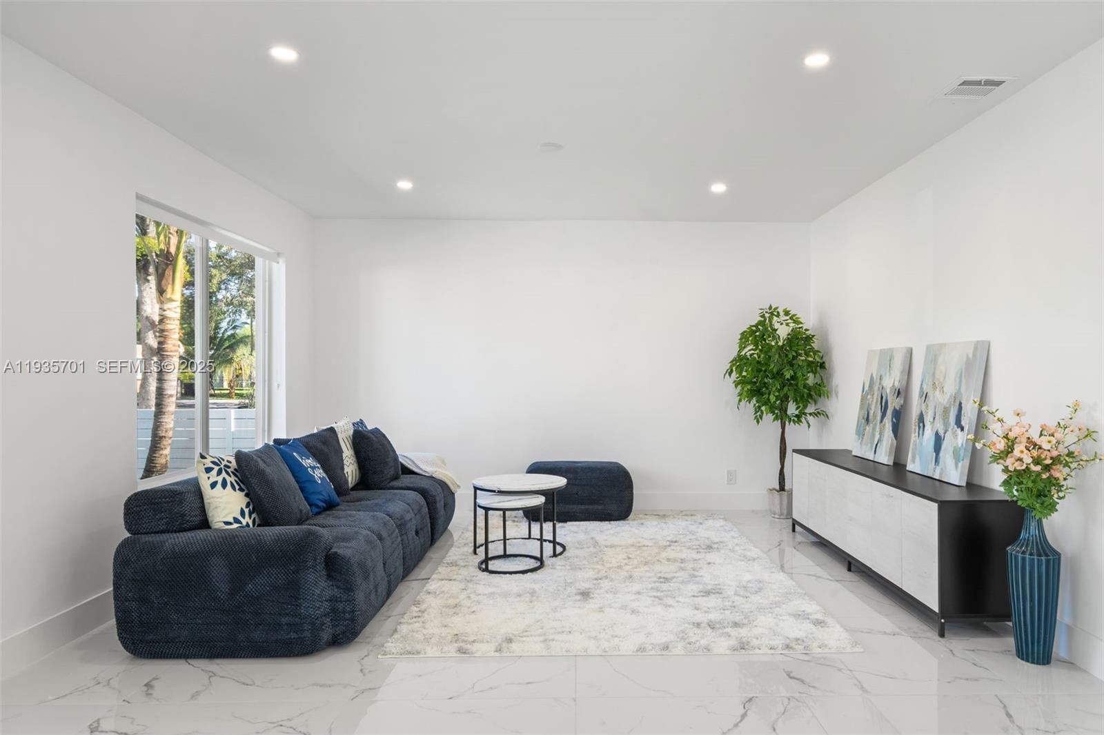 253 Southwest 4th Street Dania Beach, FL 33004 - Photo 5 of 27 a living room with furniture and a potted plant