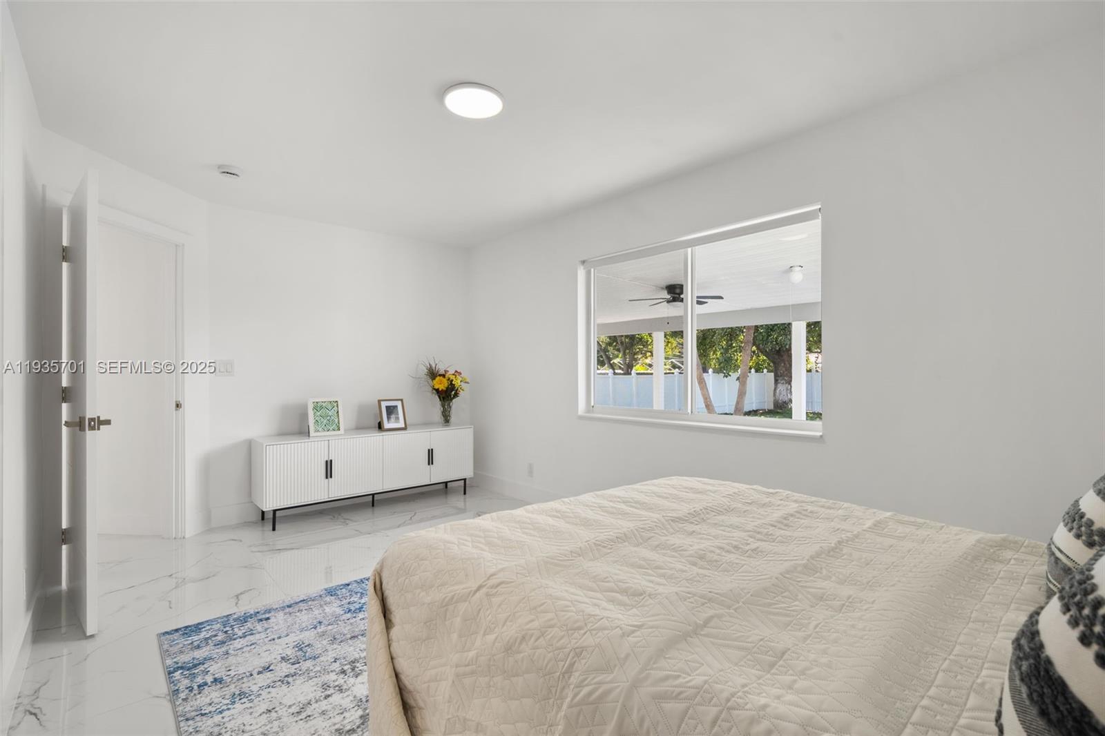 253 Southwest 4th Street Dania Beach, FL 33004 - Photo 7 of 27 a bedroom with a bed and window