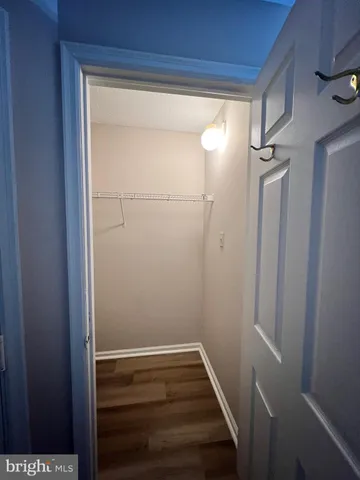 a kitchen with granite countertop a stove and cabinets