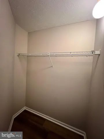 a kitchen with stainless steel appliances a stove microwave and refrigerator