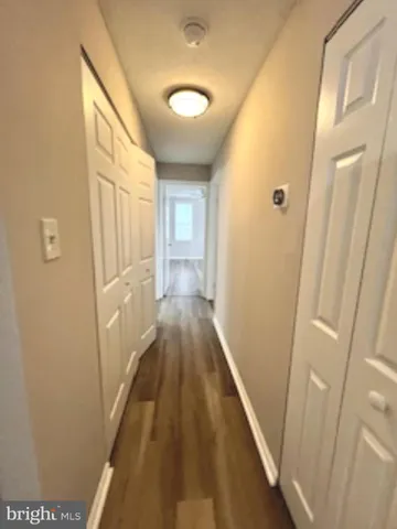 a view of a bathroom from a hallway