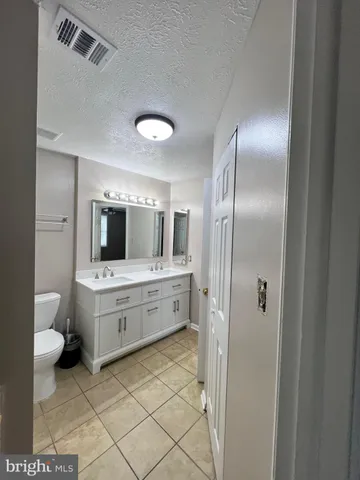 a bathroom with a bathtub a toilet and a shower