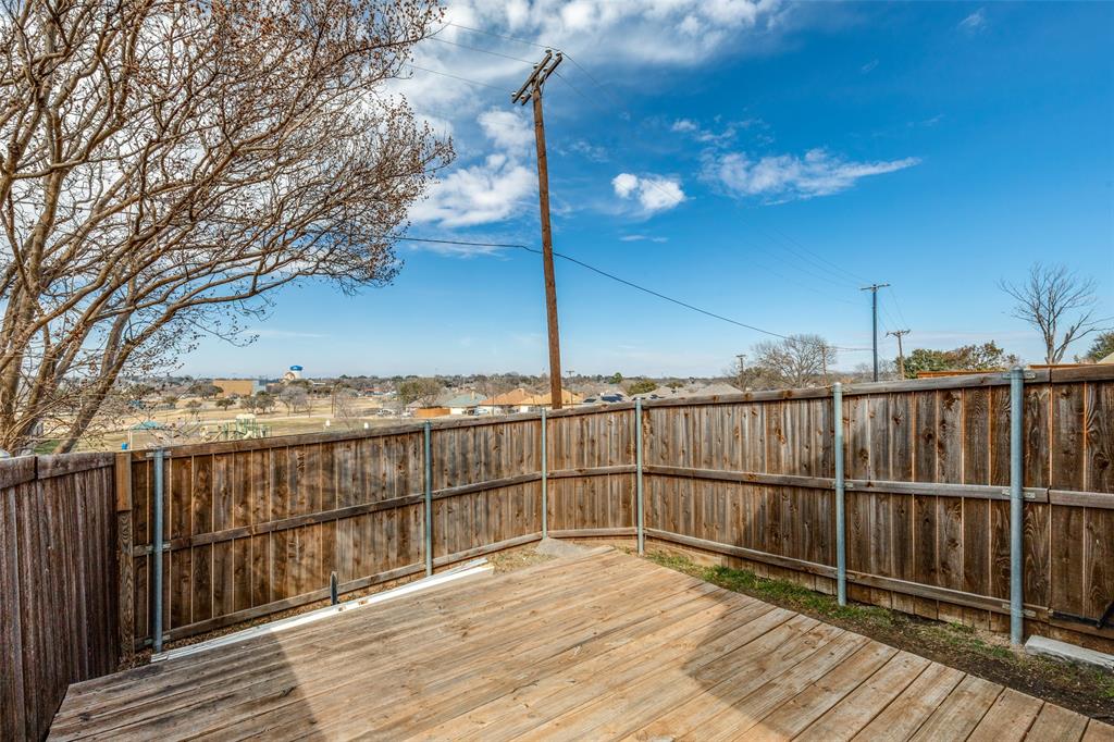 1527 Ranchview Lane Carrollton, TX 75007 - Photo 23 of 25 wooden back deck