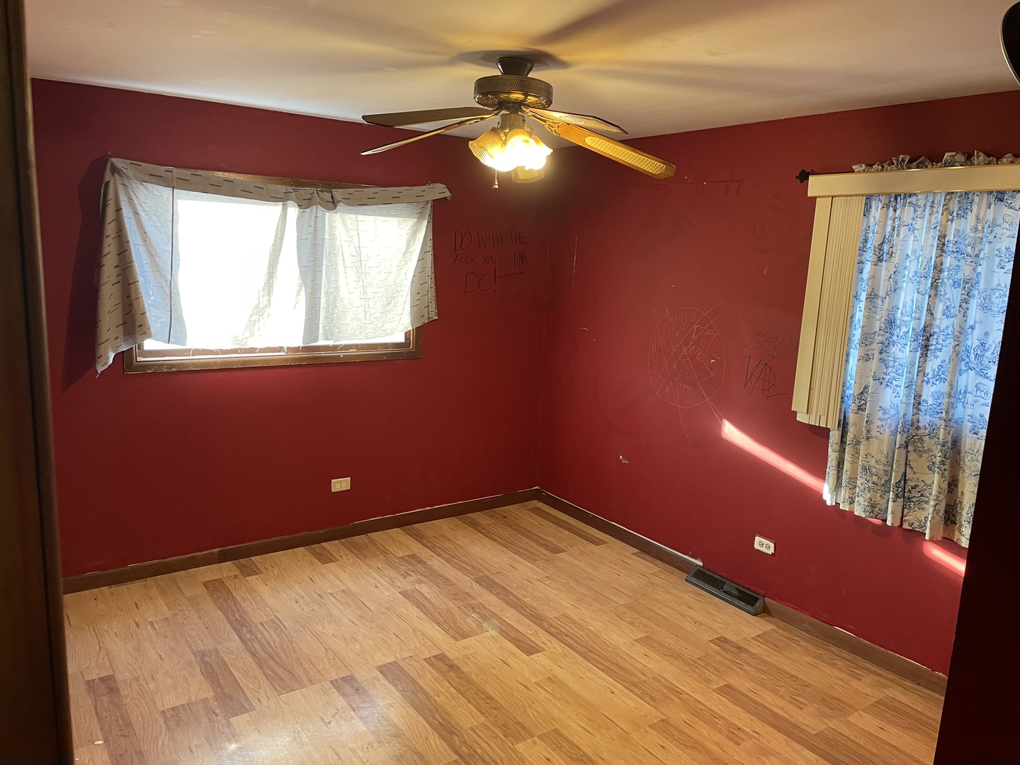 14540 Kolin Avenue Midlothian, IL 60445 - Photo 12 of 24 a room with window and chandelier fan