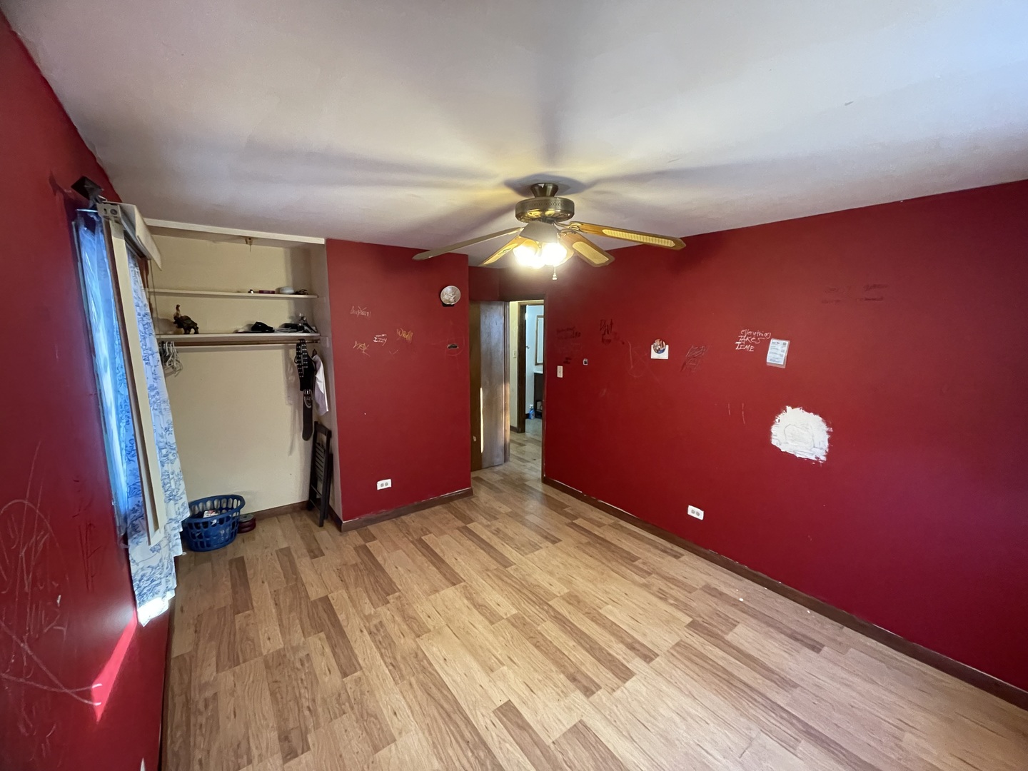 14540 Kolin Avenue Midlothian, IL 60445 - Photo 13 of 24 a view of a livingroom with a hall and a ceiling fan