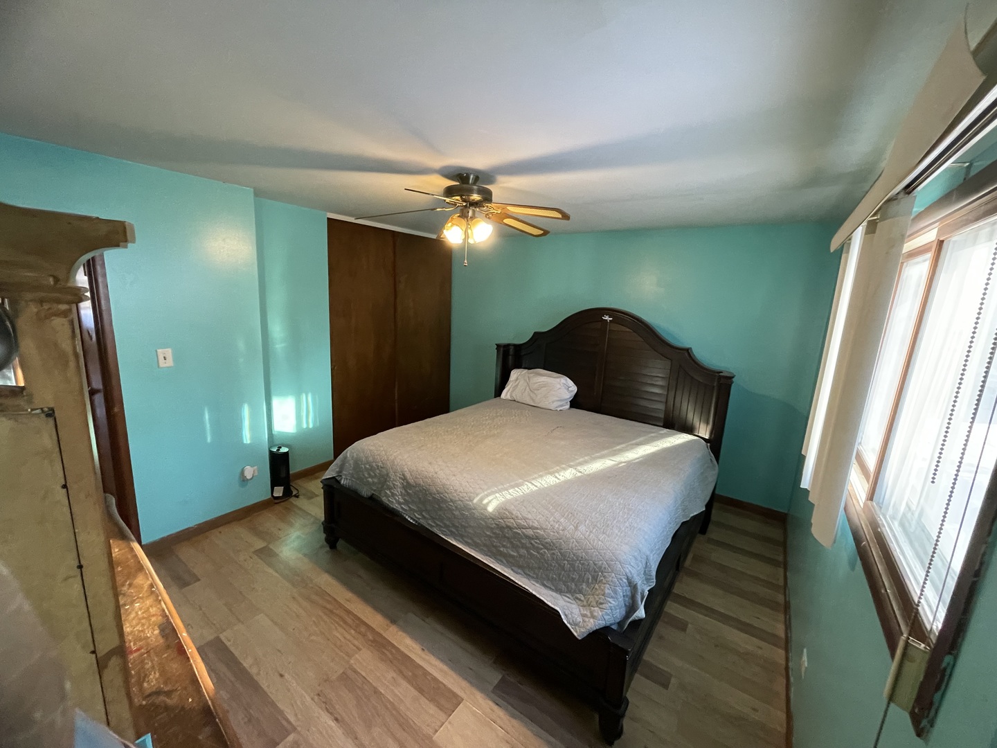 14540 Kolin Avenue Midlothian, IL 60445 - Photo 15 of 24 a bedroom with a bed and a chandelier