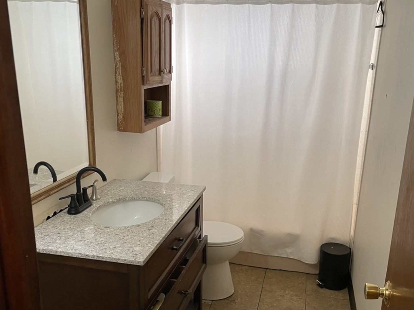 14540 Kolin Avenue Midlothian, IL 60445 - Photo 9 of 24 a bathroom with a granite countertop sink and a toilet