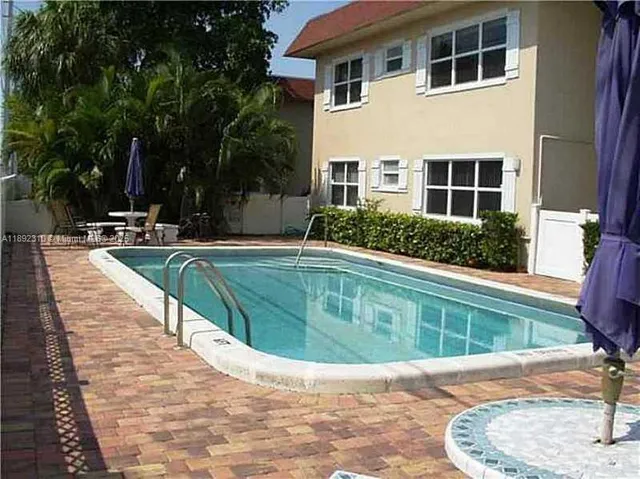 a view of a house with swimming pool