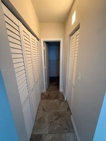 a view of a bathroom from a hallway