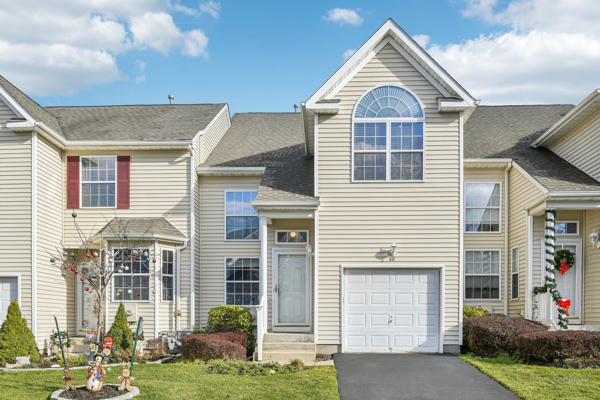 68 Crossbar Road Medford, NY 11763 - Photo 1 of 1 View of front of property with a front yard and a garage