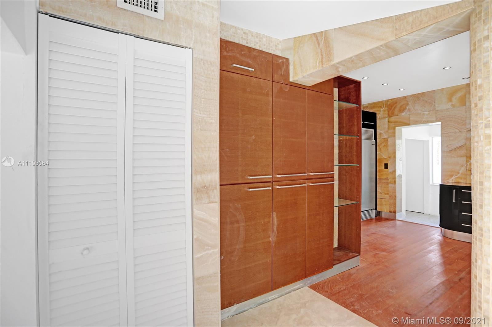 4431 Alton Road Miami Beach, FL 33140 - Photo 16 of 58 a bathroom with a shower and a glass door