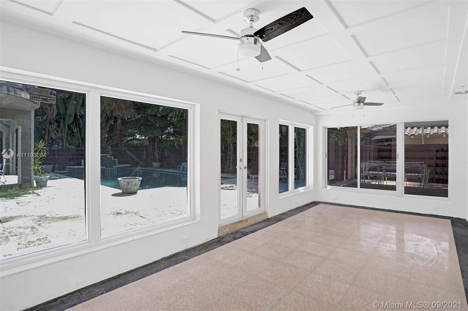 4431 Alton Road Miami Beach, FL 33140 - Photo 21 of 58 a view of an empty room with a window
