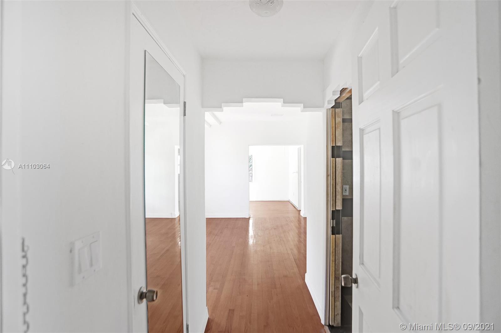 4431 Alton Road Miami Beach, FL 33140 - Photo 25 of 58 a view of a bathroom with a glass door