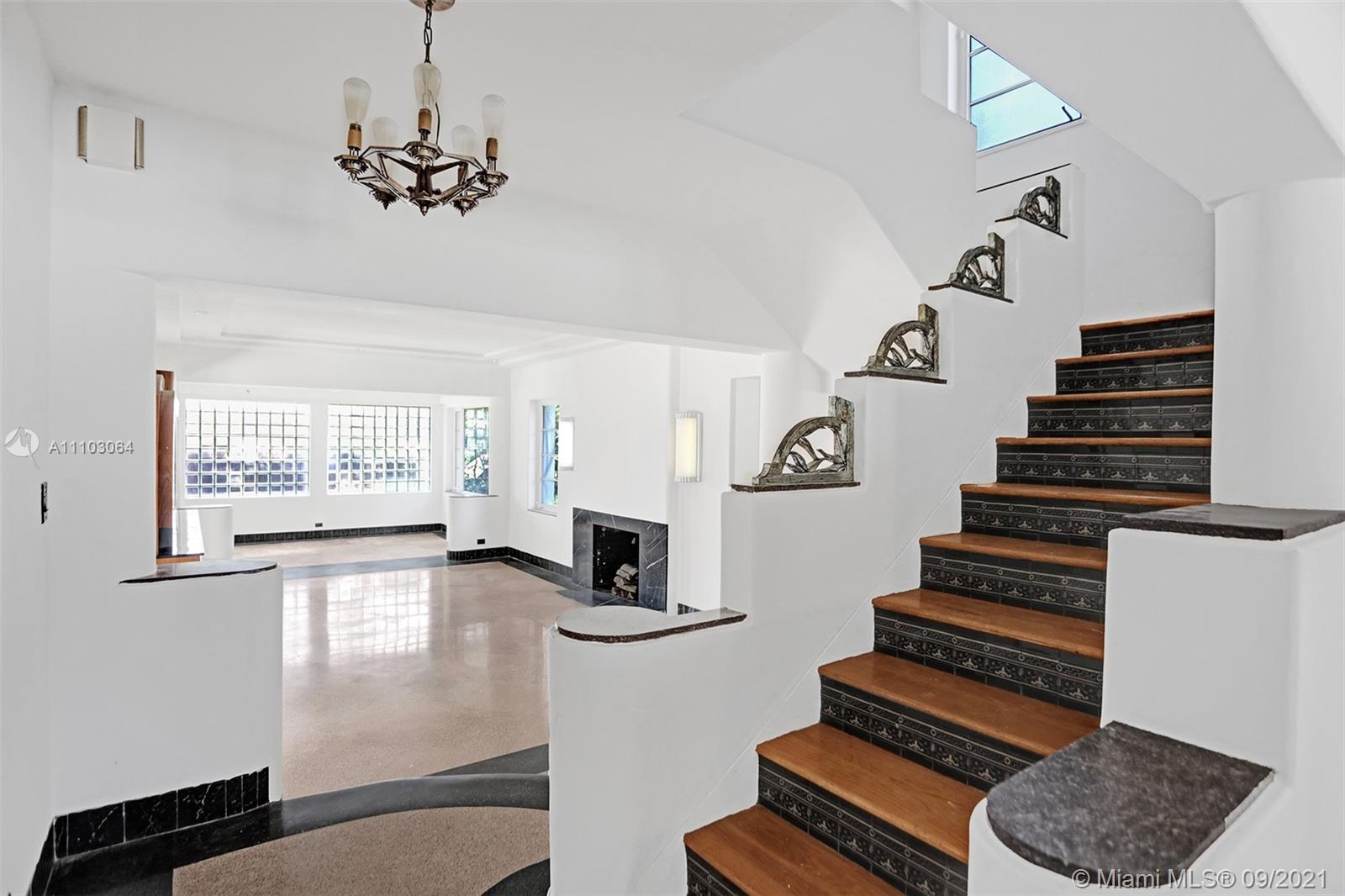 4431 Alton Road Miami Beach, FL 33140 - Photo 4 of 58 a view of entryway and hall with wooden floor
