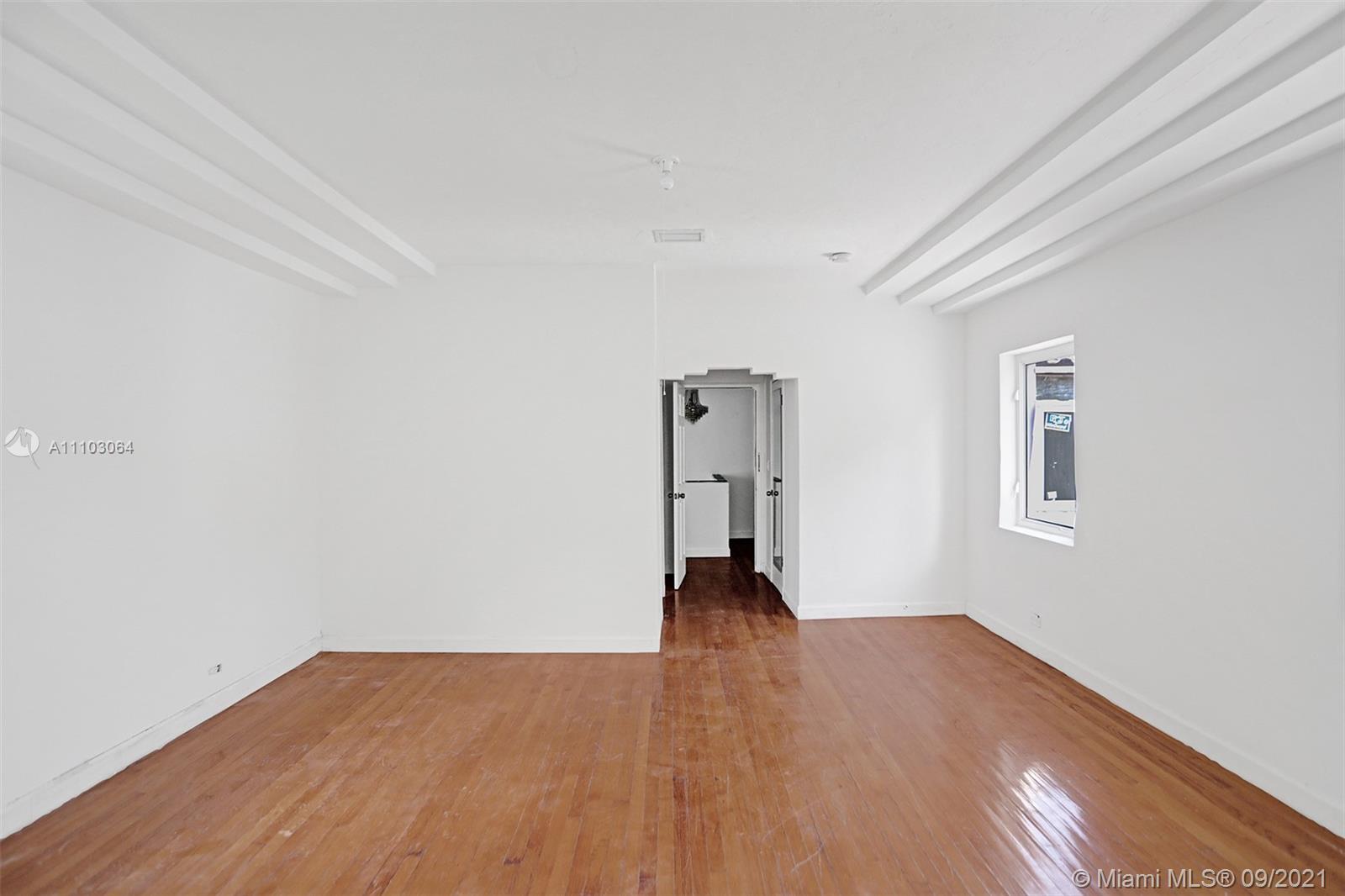 4431 Alton Road Miami Beach, FL 33140 - Photo 33 of 58 a view of empty room with wooden floor