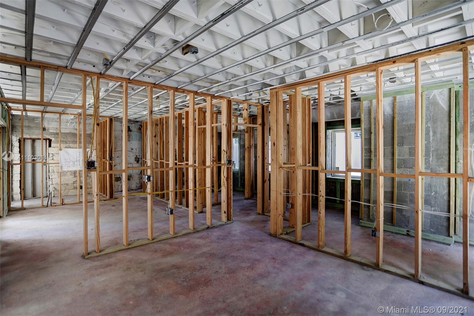 4431 Alton Road Miami Beach, FL 33140 - Photo 41 of 58 a view of a room with wooden walls