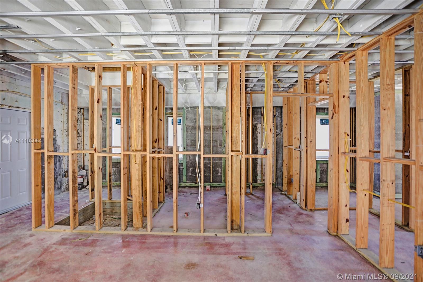 4431 Alton Road Miami Beach, FL 33140 - Photo 42 of 58 a view of a room with wooden walls