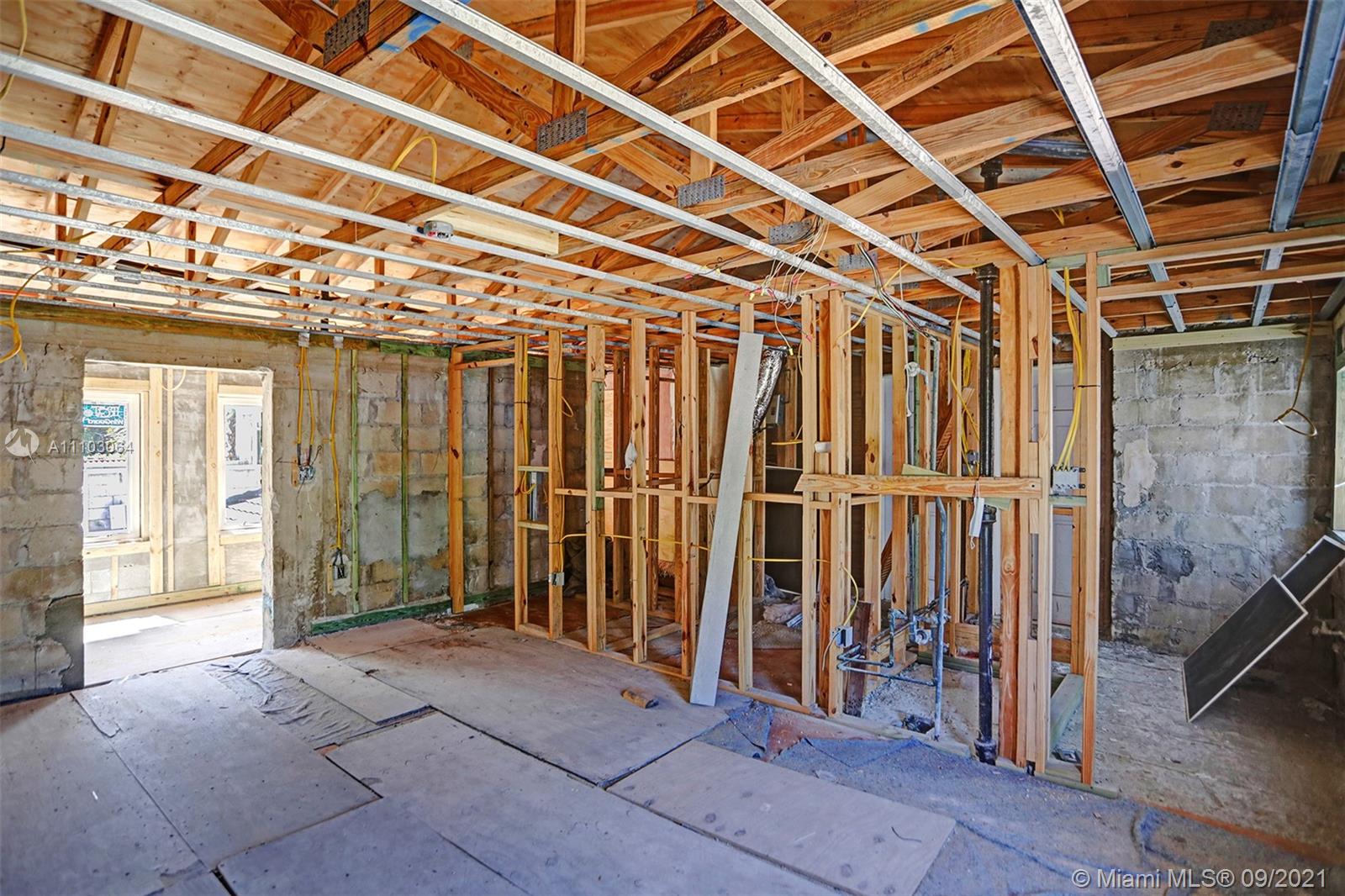 4431 Alton Road Miami Beach, FL 33140 - Photo 46 of 58 a view of a room with wooden walls
