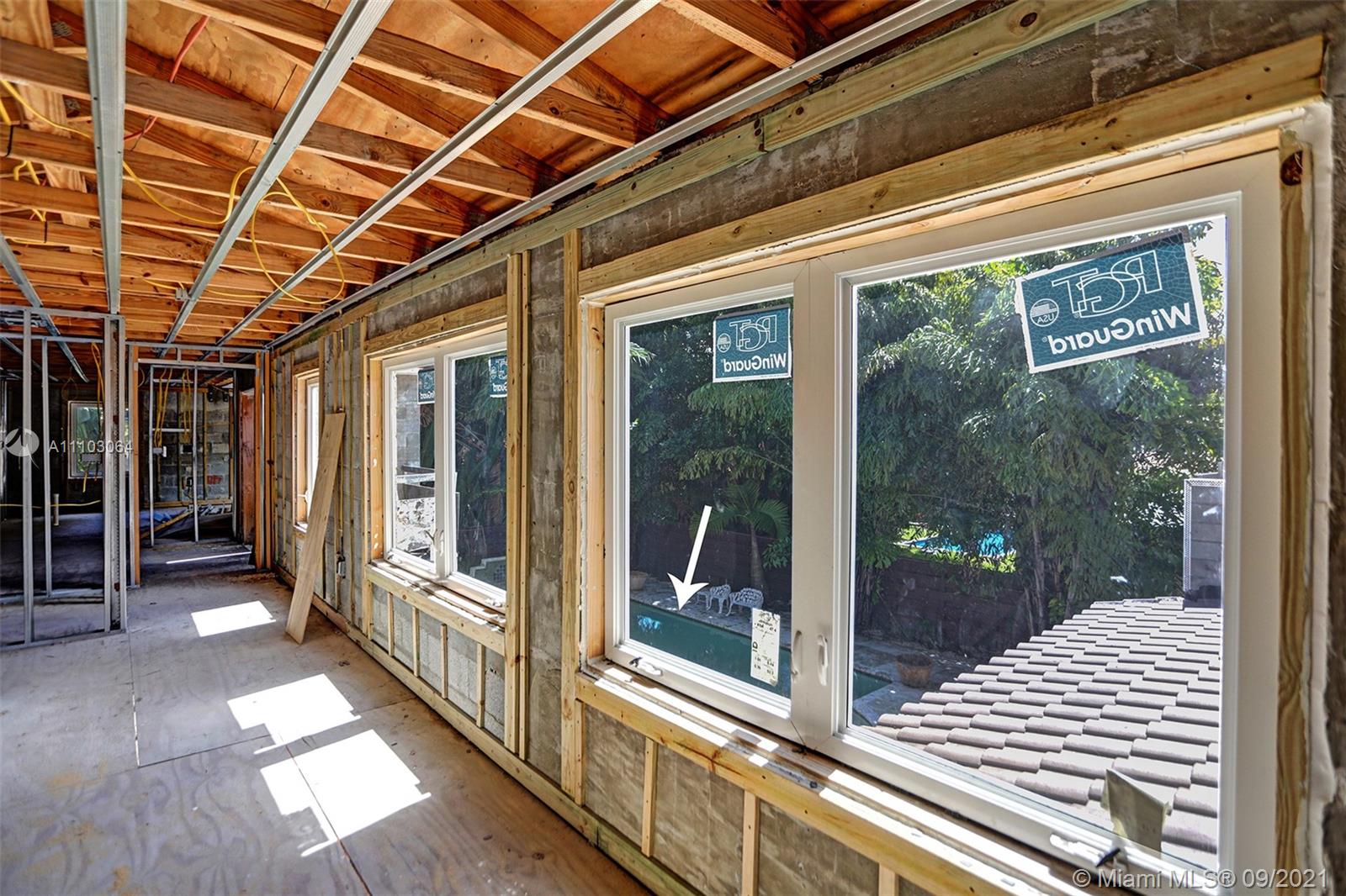 4431 Alton Road Miami Beach, FL 33140 - Photo 48 of 58 a view of porch with large windows