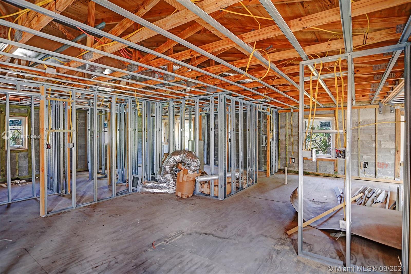 4431 Alton Road Miami Beach, FL 33140 - Photo 50 of 58 a view of a room with gym equipment