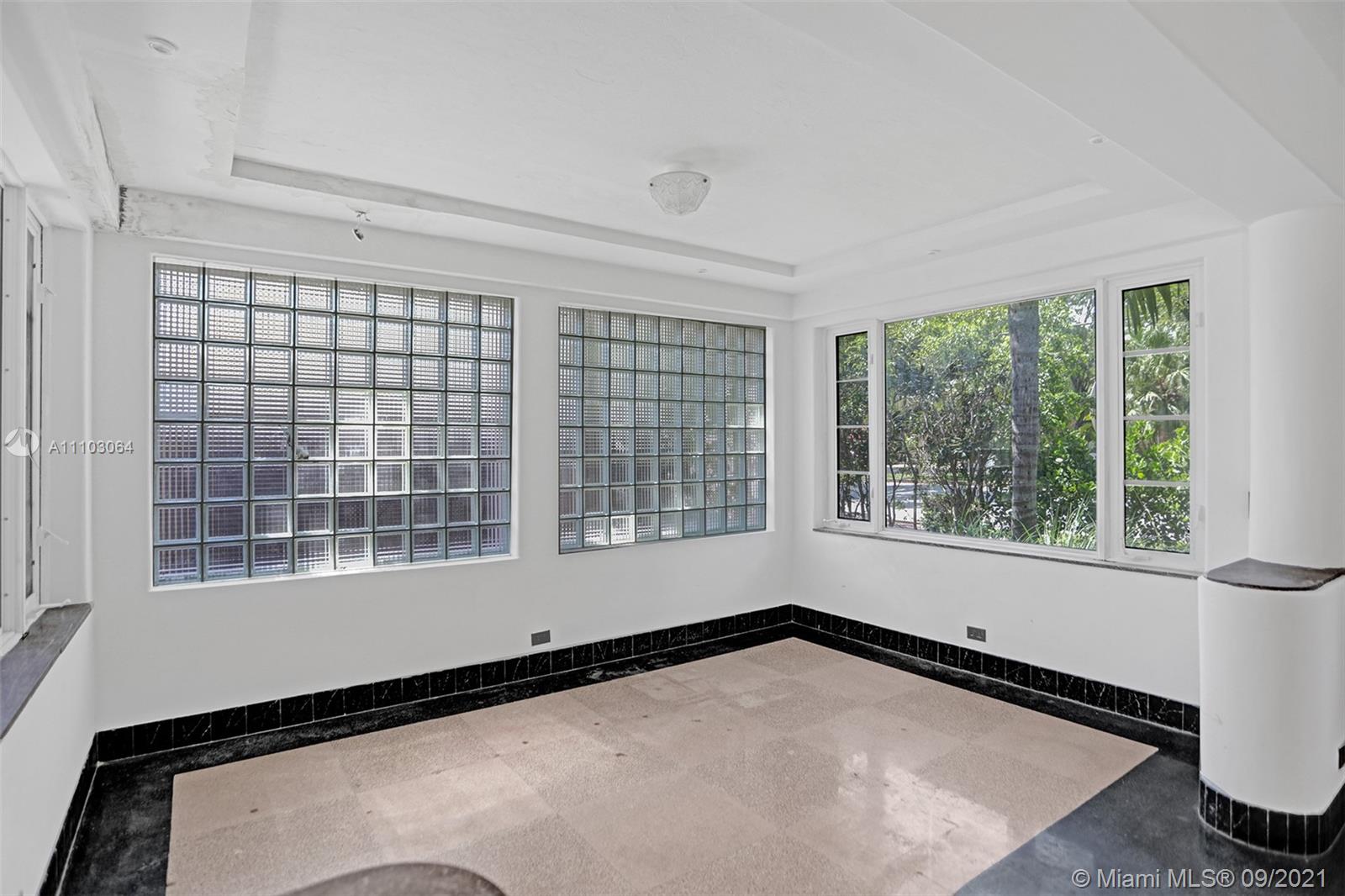 4431 Alton Road Miami Beach, FL 33140 - Photo 9 of 58 a view of an empty room with a window