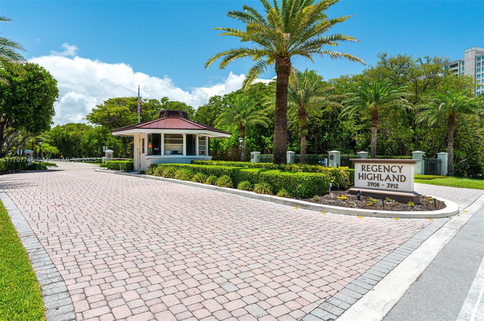 3912 South Ocean Boulevard, Unit 306 Highland Beach, FL 33487 - Photo 25 of 25 a front view of a house with a yard and potted plants