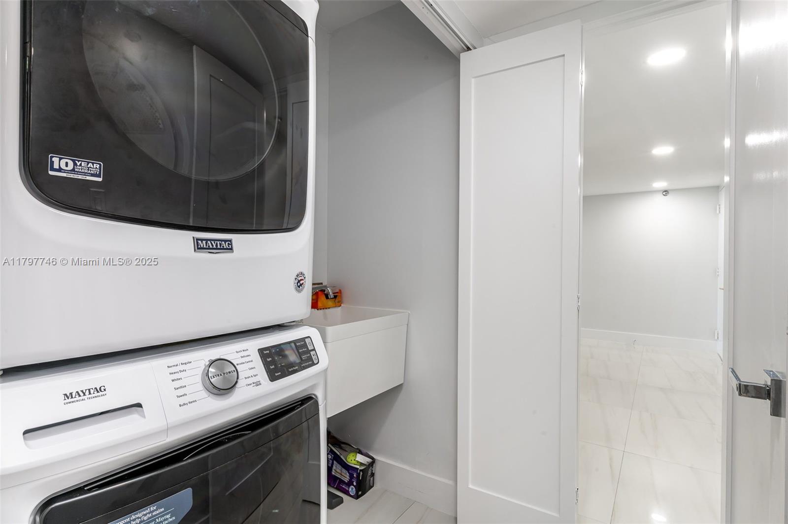 3912 South Ocean Boulevard, Unit 306 Highland Beach, FL 33487 - Photo 6 of 25 a view of washer and dryer