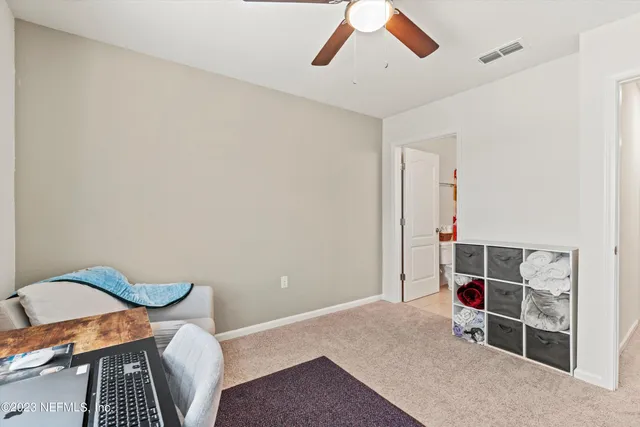 a view of a room with wooden floor and cabinet