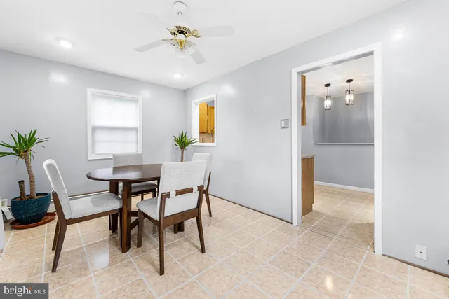 a view of a dining room with furniture and window