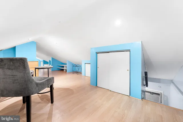 a view of livingroom with furniture and workspace